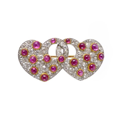 Early 20th century cabochon ruby and diamond entwined double-heart brooch, c.1915,